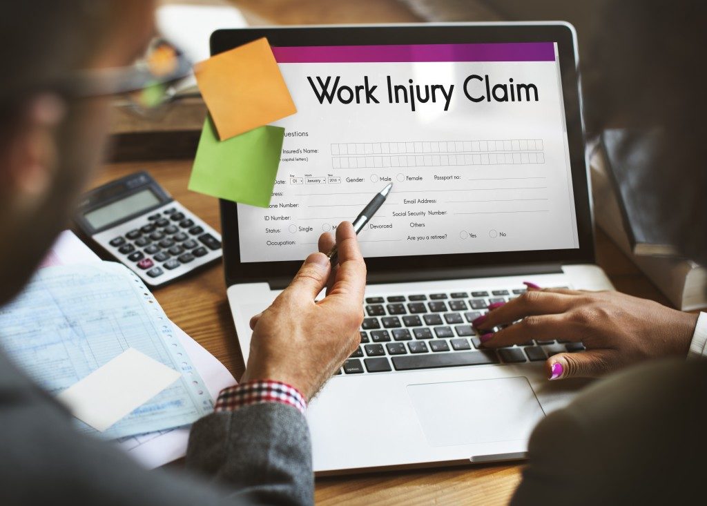 work injury claim form reflected on a laptop screen