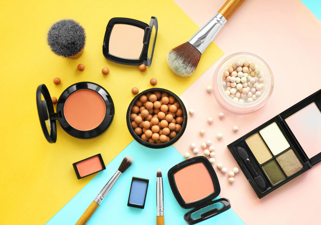 Various makeup products on a colorful table