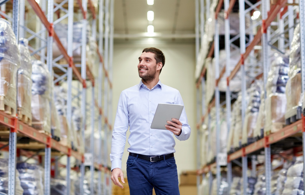 Warehouse owner using software for services
