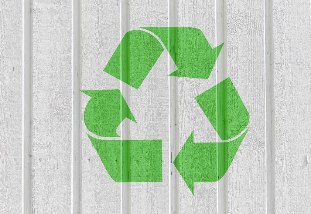 The recycling symbol on a wall