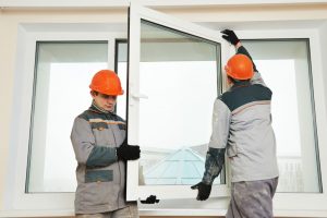 men isntalling glass window